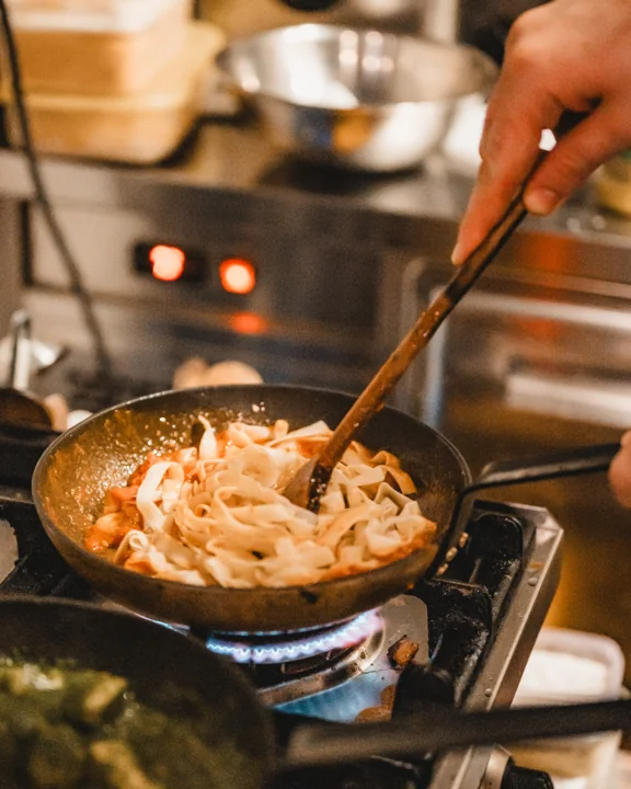 Pasta being prepared in a pan